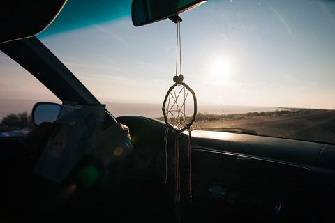 View from a car driving at sunset